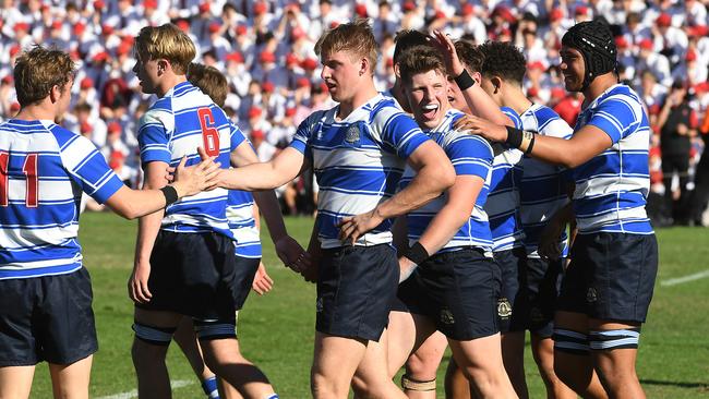 Nudgee captain Harry Vella (right of centre) celebrates a try. Saturday August 3, 2018. Picture: AAP image/John Gass