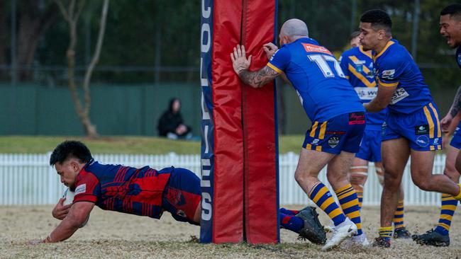 Collegians prop Jaycob Oloaga dives over in the second half. Picture: Thomas Lisson