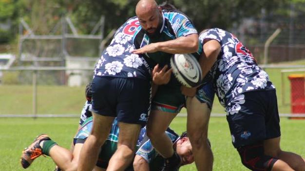 The Jabiru Bushratz and  Casuarina Cougar Old Boys come to grips in a round-robin game the Old Boys won 17-10. Picture: Friends Of Rugby