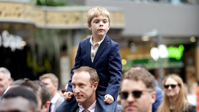 MAJ Andrew Pengaligon, Battery Commander 133rd Battery, 20 Regiment, RAA, with son Joshua Penhaligon, during the Anzac Day Parade. Photo: Steve Pohlner