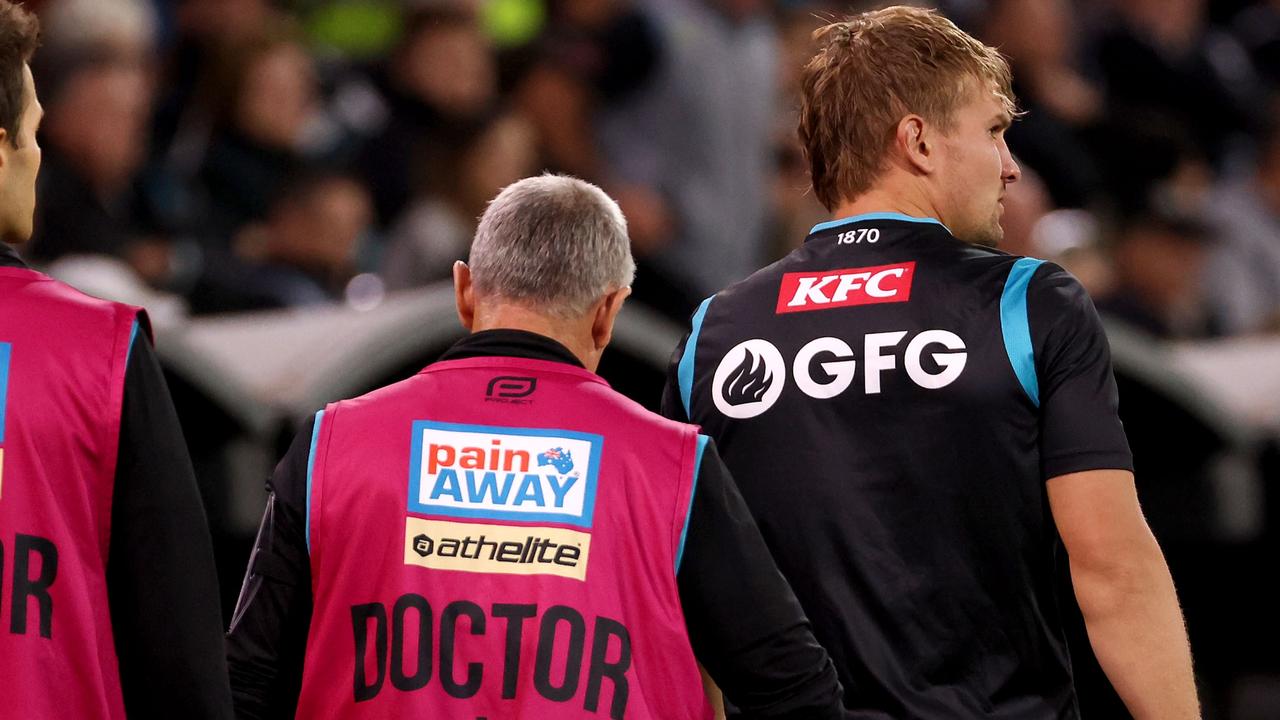 Ollie Wines was surrounded by club medical staff during the loss to Melbourne. Picture: James Elsby