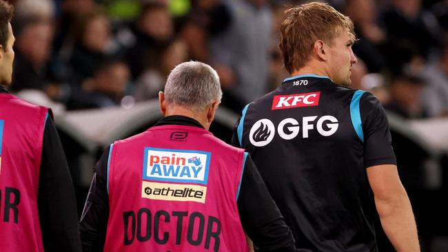 Ollie Wines was surrounded by club medical staff during the loss to Melbourne. Picture: James Elsby