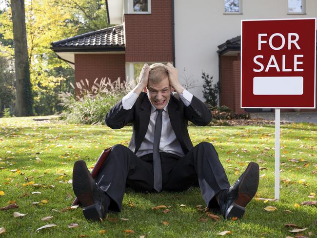 Distressed real estate agent trying to sell a house. iStock image. For Herald Sun Realestate Andrew Winter column 23JAN16