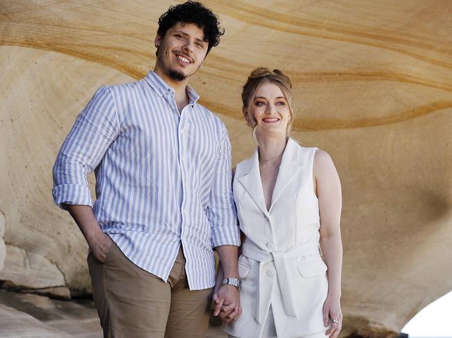 Jason Arrow with partner Alexandra Cornish at Tamarama Beach. Picture: Sam Ruttyn