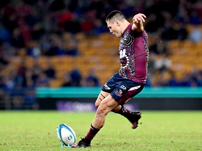 Reds flyhalf James O'Connor kicks for goal before later coming off with a hamstring injury. Picture: Bradley Kanaris/Getty Images