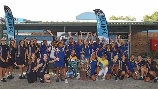 AUSSIE RULES: Students of Mountain Creek State High School and Murgon State High School, workshop facilitator Nicole Gibson and James Doyle celebrate their AFL collaboration. Picture: Eden Boyd