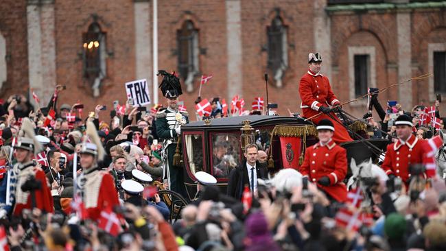 Queen Margrethe in a carriage escorted by the Guard Hussar Regiment's Mounted Squadron from Amalienborg Castle to Christiansborg Castle for her proclamation of abdication. Picture: AFP