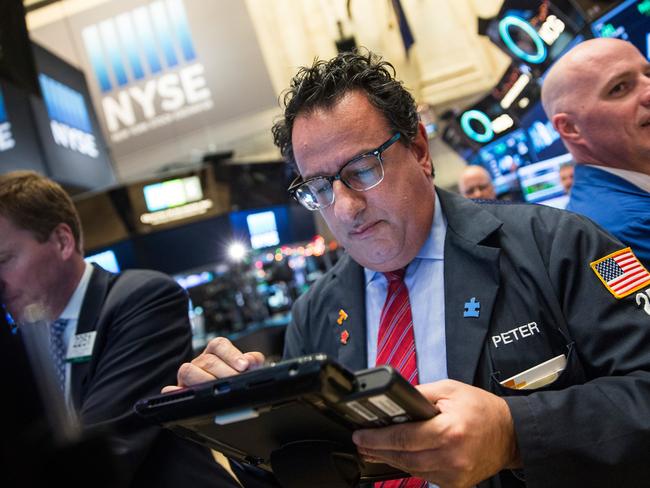 NEW YORK, NY - DECEMBER 04: Traders work on the floor of the New York Stock Exchange during the afternoon of December 4, 2015 in New York City. The market closed more than 370 points up due to positive jobs report data. Andrew Burton/Getty Images/AFP == FOR NEWSPAPERS, INTERNET, TELCOS & TELEVISION USE ONLY ==
