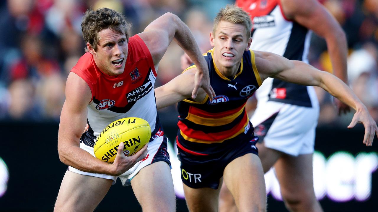 AFL - Adelaide Crows v Melbourne Demons at Adelaide Oval. Rohan Bail gets away from David McKay. PIC SARAH REED.