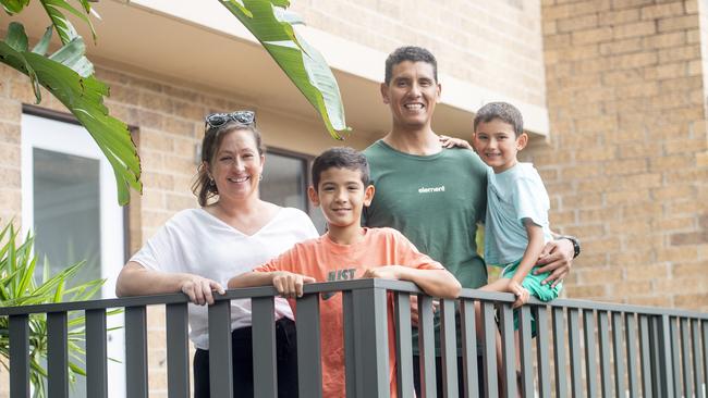 Lauren and Roberto Polanco, with sons Harvey and Lennon, at the townhouse they have for sale. Picture: Jeremy Piper