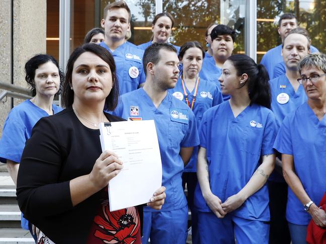 DAILY TELEGRAPH. MARCH 15, 2023.Pictured holding a press conference in Sydney today is The NSW Nurses and MidwivesÃ Association General Secretary, Shaye Candish, with members of NSWNMA, who will today confirm it is filing a major prosecution case in the Supreme Court against the state of NSW for systemic and repeated breaches of the Public Health System NursesÃ and MidwivesÃ State Award. Picture: Tim Hunter.