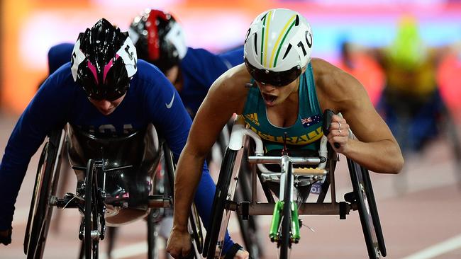 Madison de Rozario of Australia crosses the finish line to win gold in the final of the womens 5000m T54 on day nine of the IPC World ParaAthletics.