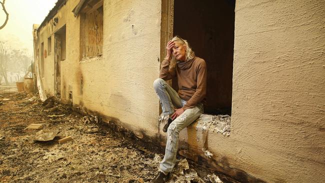 Jann Gilbert visits the site of her burnt-out unit. Picture: David Caird