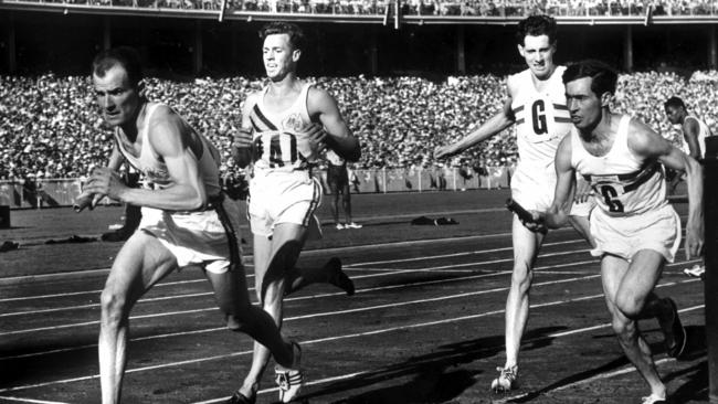 Gosper takes the baton for Australia during the relay at the Melbourne Olympics