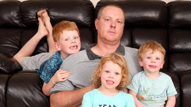 FEE INCREASE: Brendan Jones with his children Eli, 6, Sameen, 4 and Isaac, 2, says he believes he will be paying more for child care. Picture: AAP Image/Richard Gosling