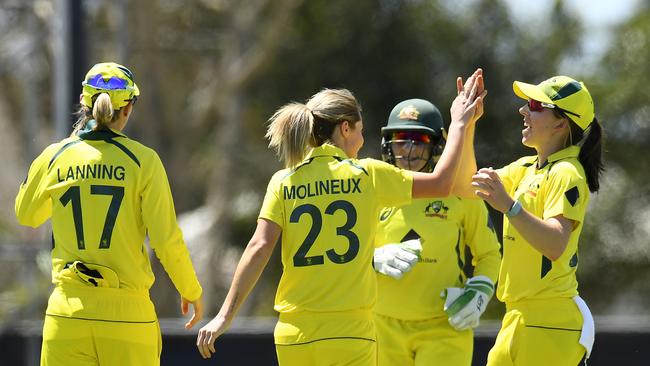 Sophie Molineux of Australia celebrates with teammates after dismissing Mithali Raj of India during game one of the Women’s One Day International series between Australia and India at Great Barrier Reef Arena on September 21, 2021 in Mackay, Australia. Picture: Albert Perez/Getty Images