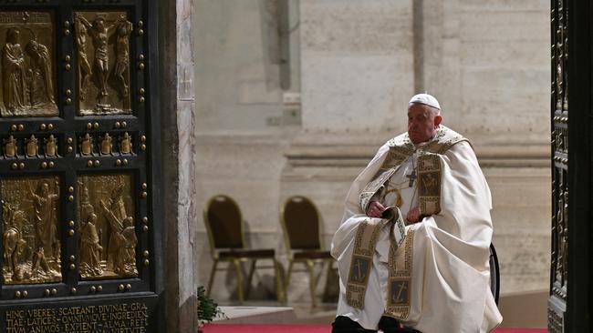 Pope Francis opens the Holy Door of St Peter's Basilica in the Vatican to mark the start of the Catholic Jubilee Year. Picture: AFP.