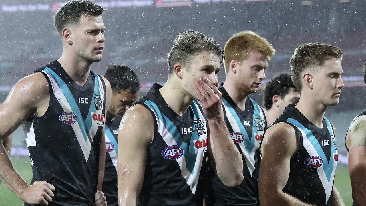 Port Adelaide walks off after Round 15’s upset loss to the Western Bulldogs. Photo: Sarah Reed