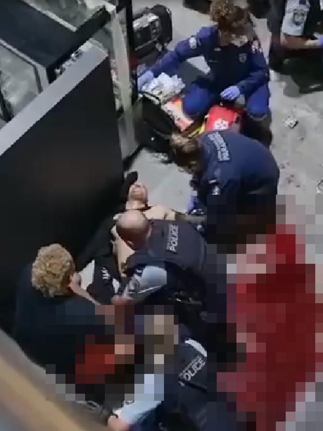 Emergency service personnel work on Comanchero bikie gang member Tarek Zahed after he and his brother Omar were shot multiple times at the Bodyfit gym in Auburn. Picture: Supplied