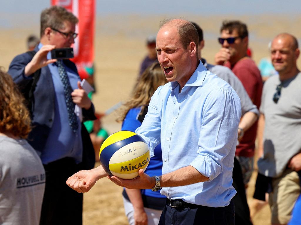 Prince William had a crack at volleyball during his visit to Fistral Beach in Newquay in Cornwall. Picture: AFP