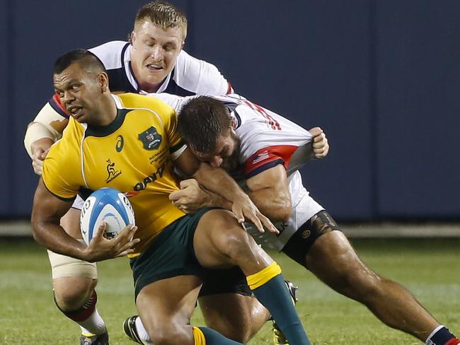 Kurtley Beale is swamped by Louis Stanfill and Phillip Thiel.