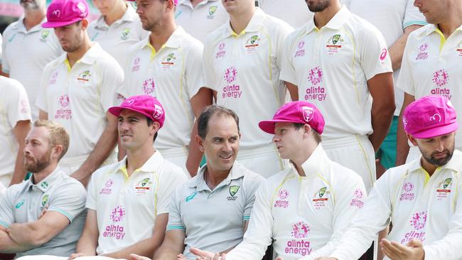 The Australians line up for a team picture in the Pink Test caps