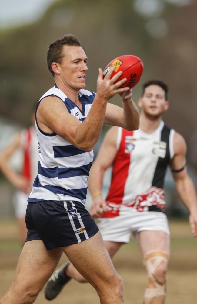 Former North Melbourne and West Coast star Drew Petrie pulls down a mark for Pearcedale. Picture: Valeriu Campan.