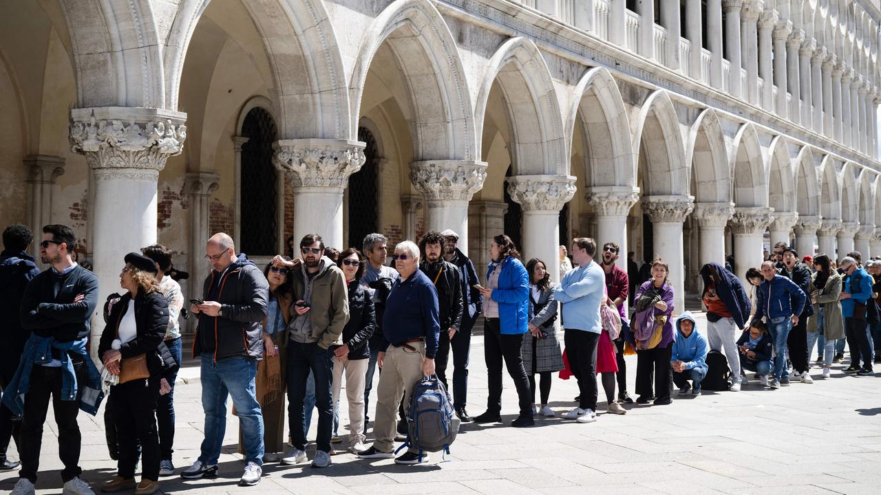 Visitors queue to enter the Basilica in San Marco Square in Venice, on April 25. Picture: Marco Bertorello / AFP