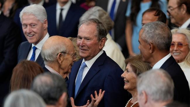 Retired US Supreme Court Justice Stephen Breyer talks with Laura Bush as former presidents George W. Bush, Bill Clinton and Barack Obama listen. Picture: AFP