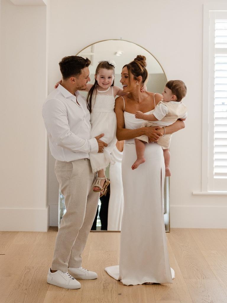 Itsines and Woodroffe on their wedding day with their children, Arna and Jax. Picture: Instagram/@kayla_itsines