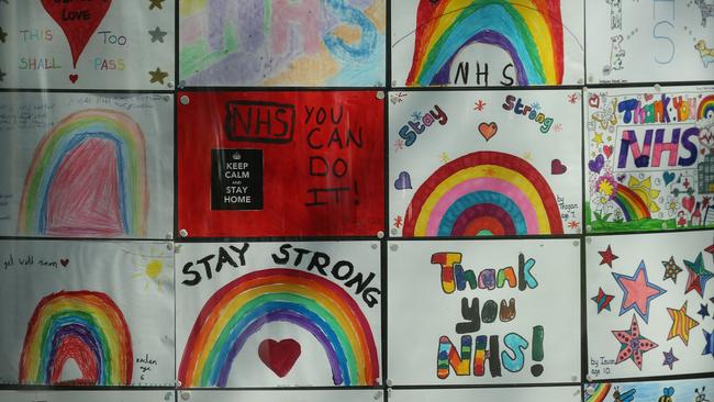 Messages of support for the NHS (National Health Service) are seen in windows of a building close to St Thomas' Hospital in central London where Britain's prime minister Boris Johnson has been moved out of intensive care. Picture: AFP