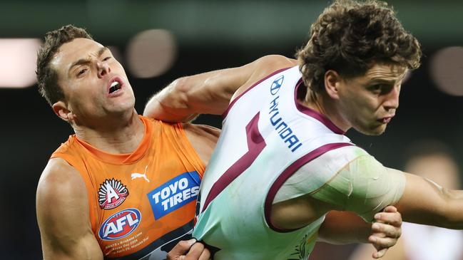 CANBERRA, AUSTRALIA - APRIL 25: Jarrod Berry of the Lions is tackled by Josh Kelly of the Giants during the round seven AFL match between Greater Western Sydney Giants and Brisbane Lions at Manuka Oval, on April 25, 2024, in Canberra, Australia. (Photo by Mark Metcalfe/AFL Photos/via Getty Images )