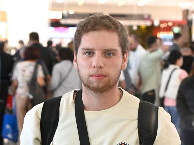 Idan (no surname) at Sydney International airport , just returned from Israel after fleeing the conflict . Photo Jeremy Piper