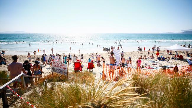 Thousands of Falls Festival punters flocked to Marion Bay Beach on a scorching day. Picture: PATRICK GEE