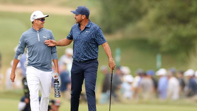 Rickie Fowler and Jason Day walk up the seventh hole. Picture: Ezra Shaw/Getty Images/AFP