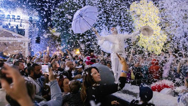 An angelic performer parties among WOMADelaide festivalgoers during a performance of Place des Anges at Botanic Park. Picture: Wade Whitington