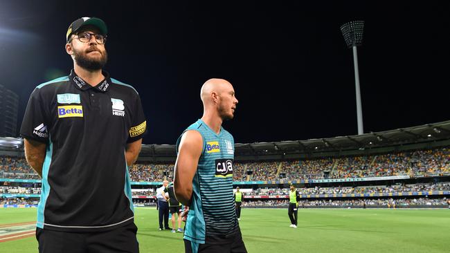 Brisbane Heat coach Daniel Vettori and captain Chris Lynn leave the Gabba after the light tower in the background refused to di its job. Picture: Darren England