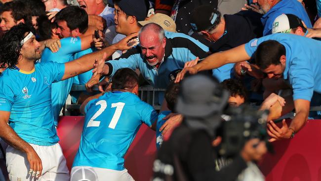 KAMAISHI, JAPAN - SEPTEMBER 25: Uruguay celebrate with friends and family after winning the Rugby World Cup 2019 Group D game between Fiji and Uruguay at Kamaishi Recovery Memorial Stadium on September 25, 2019 in Kamaishi, Iwate, Japan. (Photo by Koki Nagahama/Getty Images)