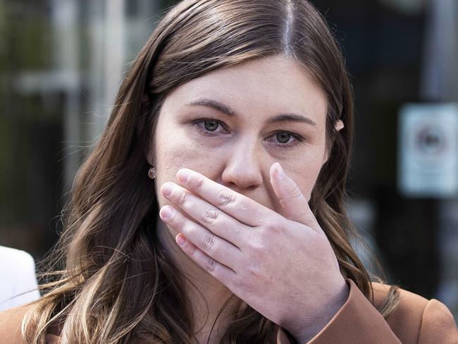 CANBERRA, AUSTRALIA NewsWire Photos OCTOBER 27, 2022:An upset Brittany Higgins with her partner David Sharaz left the Magistrates Court in Canberra. Her mum Kelly Higgins was with her.Picture: NCA NewsWire / Gary Ramage