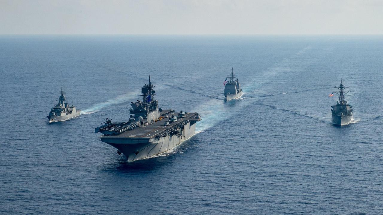 Royal Australian Navy helicopter frigate HMAS Parramatta with amphibious assault ship USS America, guided-missile cruiser USS Bunker Hill and guided-missile destroyer USS Barry in the South China Sea. Picture: Department of Defence