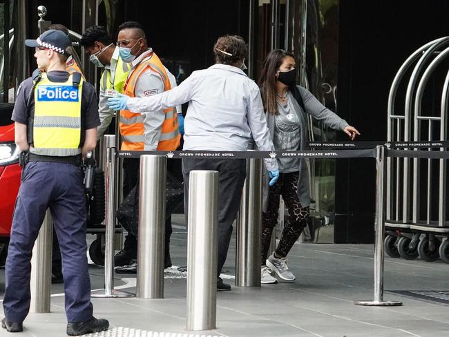 Recently arrived overseas travellers wait to check in at the Crown Promenade Hotel in Melbourne.