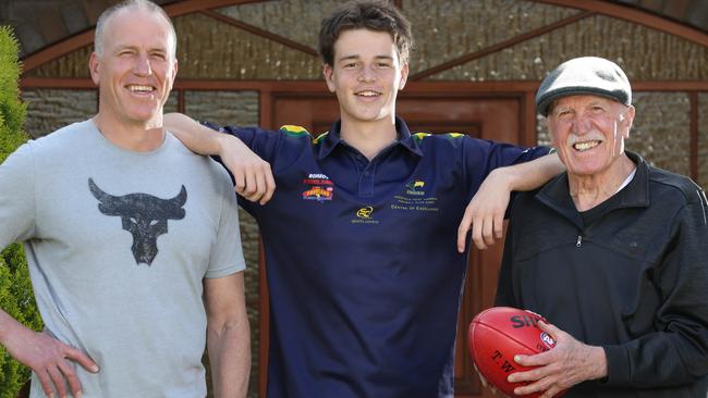 Three generations of Phillipou footballers, from left, Sam, Mattaes and Peter. Picture: Dean Martin