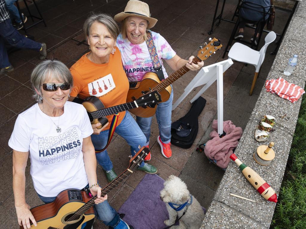 Lil Darlins members (from left) Steph Gaunt, Karen James and Cath McCourt with their dog Freddie travelled from Cleveland to perform at the Toowoomba Busking Festival, Saturday, April 29, 2023. Picture: Kevin Farmer