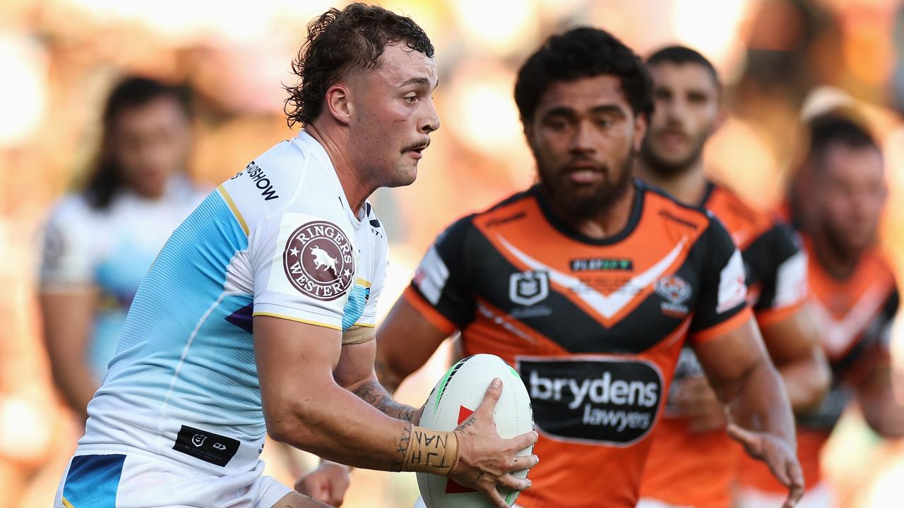 SYDNEY, AUSTRALIA - MARCH 05: Aaron Schoupp of the Titans runs the ball during the round one NRL match between the Wests Tigers and the Gold Coast Titans at Leichhardt Oval on March 05, 2023 in Sydney, Australia. (Photo by Cameron Spencer/Getty Images)