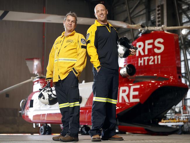 RFS helicopter pilots Nathan Soster and John Fryer with the Chinook. Picture: Sam Ruttyn