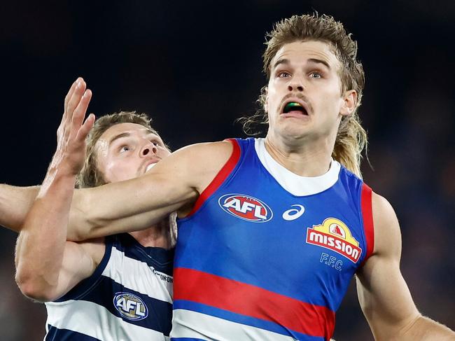 MELBOURNE, AUSTRALIA - JUNE 03: Bailey Smith of the Bulldogs and Tom Atkins of the Cats compete for the ball during the 2023 AFL Round 12 match between the Western Bulldogs and the Geelong Cats at Marvel Stadium on June 3, 2023 in Melbourne, Australia. (Photo by Michael Willson/AFL Photos via Getty Images)