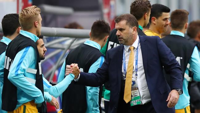 Ange Postecoglou manager of Australia shakes hands with his Australia player.