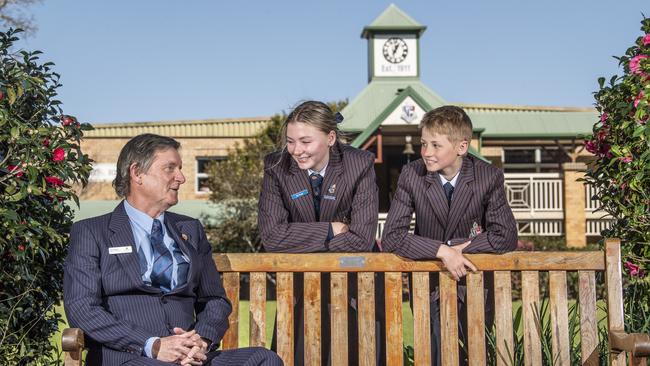 Retiring house master Ian Basset chats to students Lily Kruger and Izak Kruger at Toowoomba Anglican School. Picture: Nev Madsen.