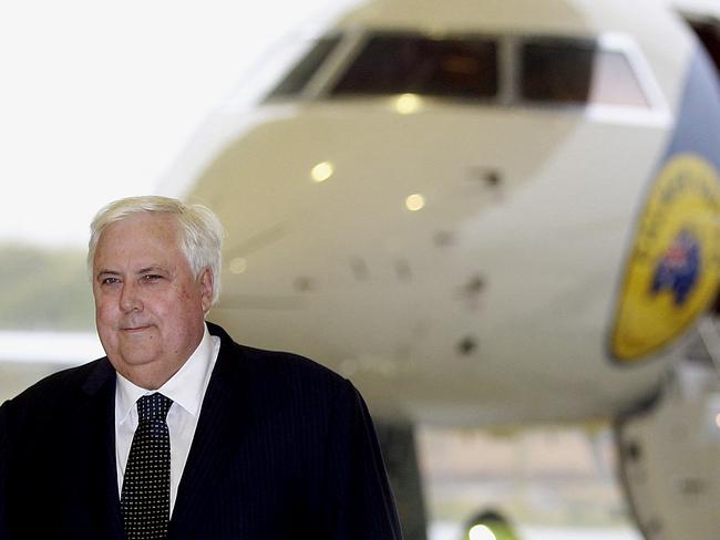 Palmer United Party federal leader Professor Clive Palmer arrives to Brisbane General aviation hanger in one of his newly painted jets. Picture: Jonathon Searle