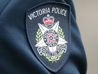 MELBOURNE, AUSTRALIA - MARCH 24:  A detail of the Victoria police badge on a police officer during a memorial service to honour Constable Angela Taylor on March 24, 2016 in Melbourne, Australia. Today marks the 30th anniversary of the Russell Street bombing, which killed Constable Taylor and injured 21 others when a car bomb exploded outside the Russell Street Police Station in 1986.  (Photo by Scott Barbour/Getty Images)